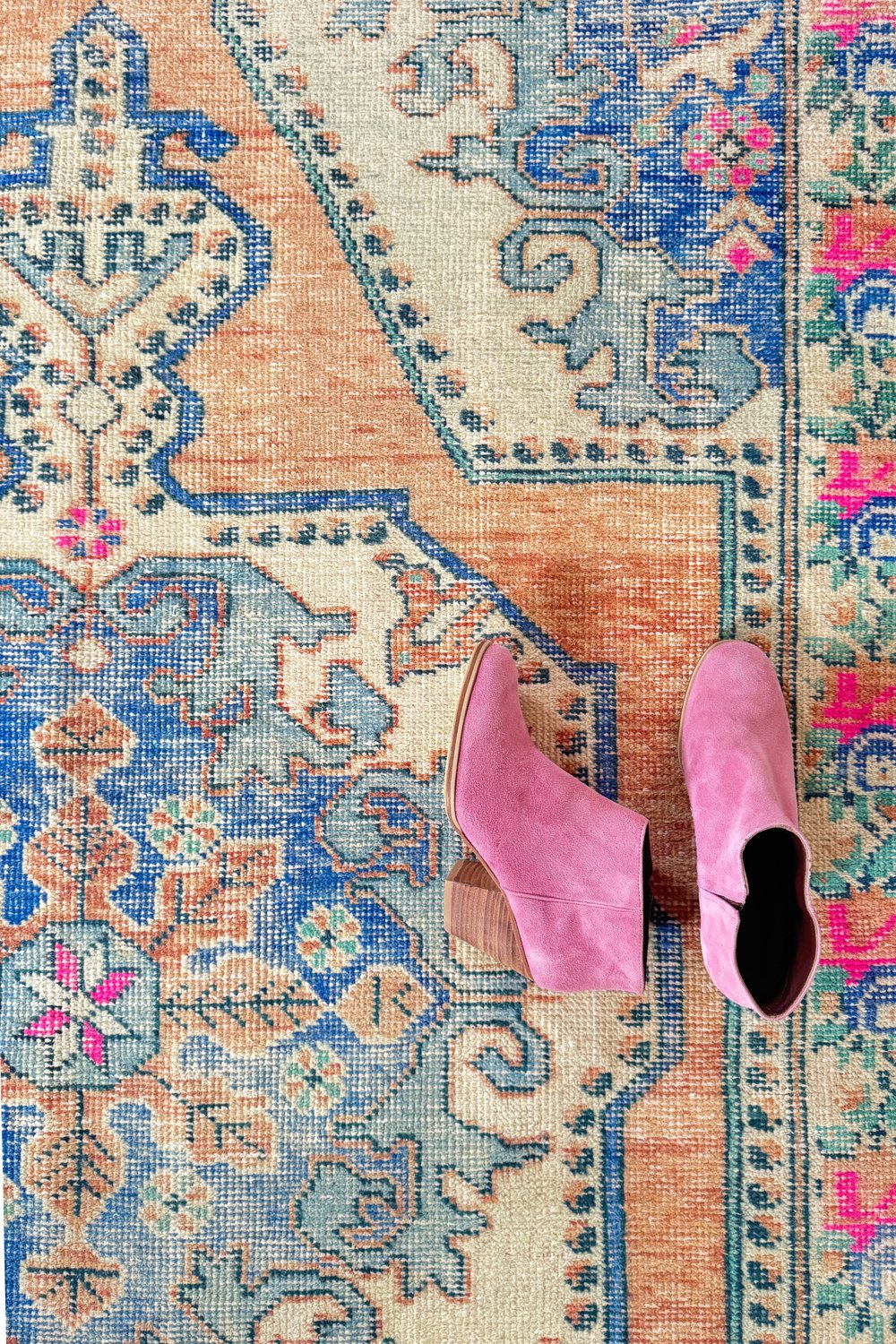 'Bethel' Vintage Turkish Rug - 4'6.5" x 7'5" - Canary Lane
Close up of a vintage handwoven Turkish area rug showcasing an intricate floral and medallion pattern. The design features rich, vibrant colors like cream, pink, blue, and peach, with a detailed floral border. Its luxurious texture and classic style bring sophistication and warmth to any space.