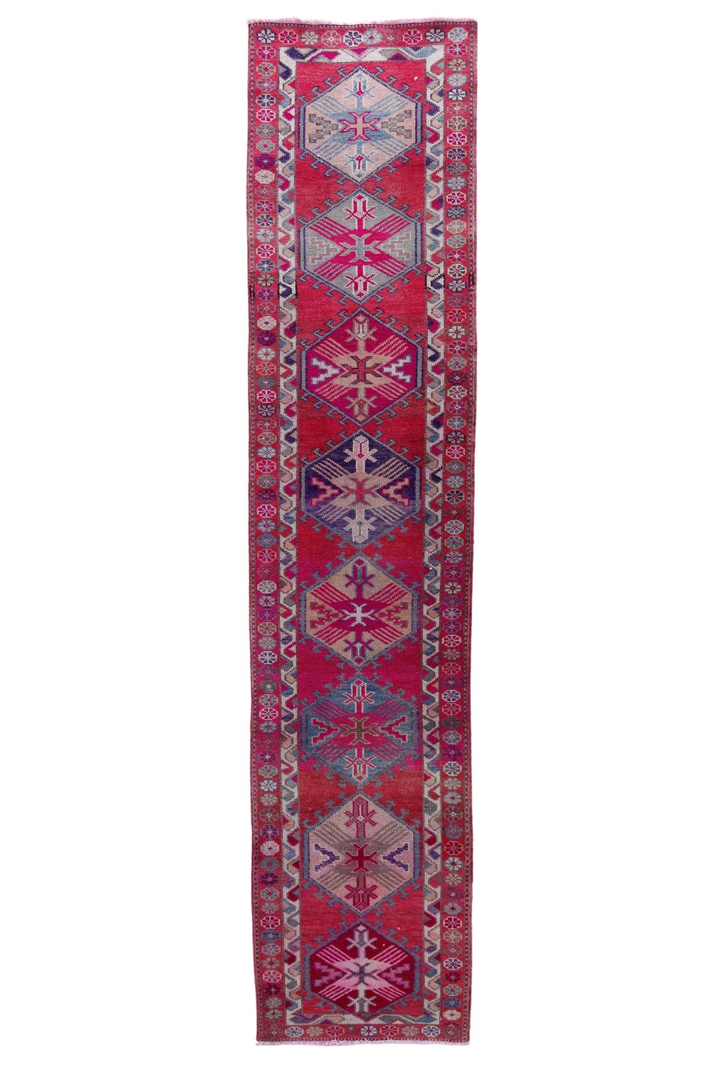 'Dutton' Vintage Turkish Runner - 2'11.5" x 13'5.5" - Canary Lane
Vintage handwoven Turkish runner showcasing an intricate medallion pattern. The design features rich, vibrant colors like red, pink, pink, purple, cream, and tan, with detailed borders. Its luxurious texture and classic style bring sophistication and warmth to any space.