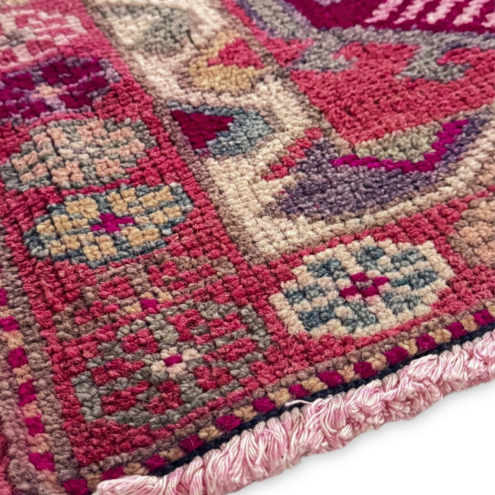 
                  
                    'Dutton' Vintage Turkish Runner - 2'11.5" x 13'5.5" - Canary Lane
Close up of a vintage handwoven Turkish runner showcasing an intricate medallion pattern. The design features rich, vibrant colors like red, pink, pink, purple, cream, and tan, with detailed floral borders. 
                  
                