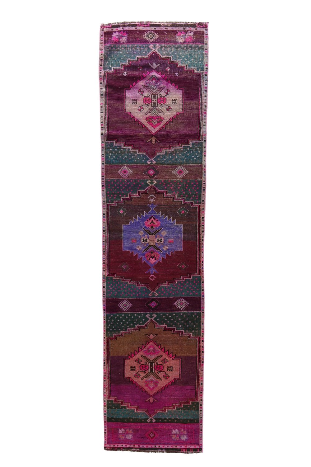 'Foster' Vintage Turkish Runner - 2'5" x 9'9" - Canary Lane
Vintage handwoven Turkish runner with intricate patterns and rich textures. Features traditional designs in purple, deep sangria, teal, pink, brown, and blue, blending warm and cool tones. A timeless piece that adds character and uniqueness to any space.