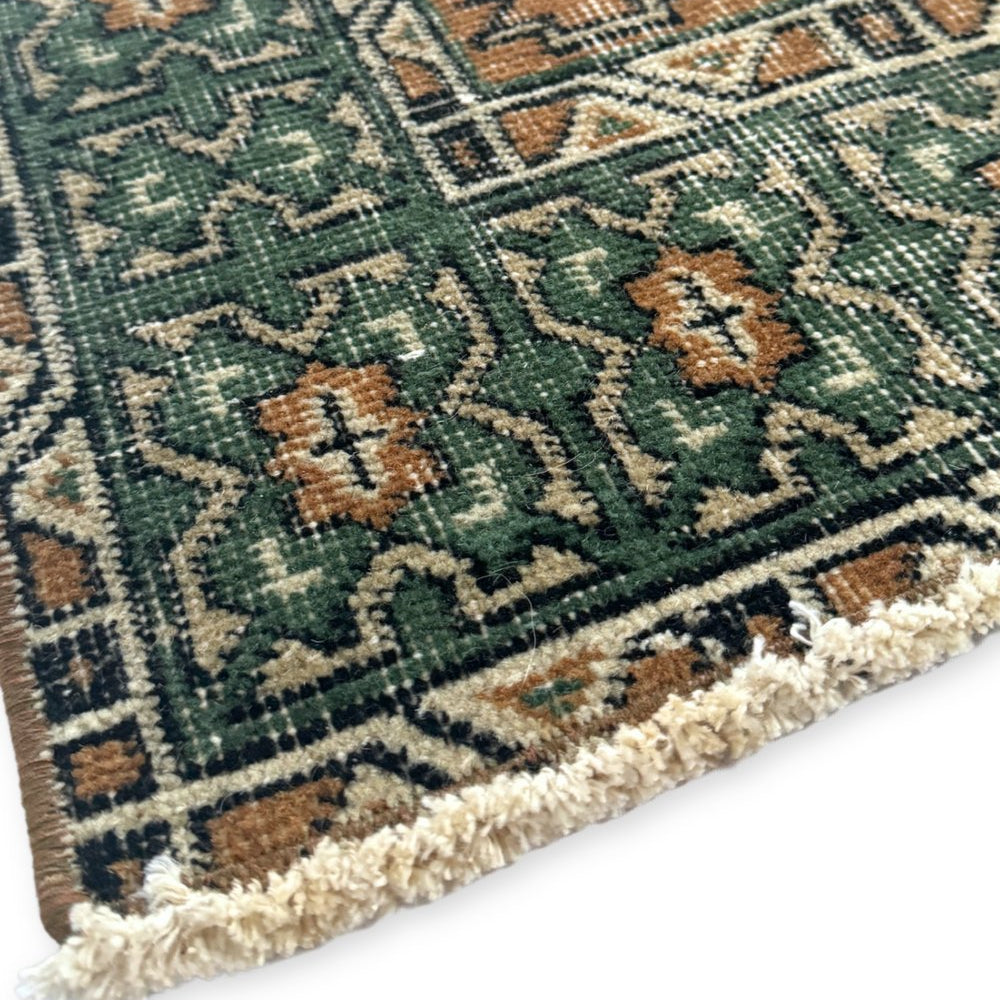 
                  
                    'Gwynn' Vintage Turkish Rug - 3'8.5" x 7'7" - Canary Lane
Close up of a vintage handwoven Turkish area rug showcasing an intricate floral pattern. The design features rich, vibrant colors like peach, teal, cream, and charcoal gray, with a blend of warm and cool tones and detailed borders. Its luxurious texture and classic style bring sophistication and warmth to any space. Featuring neat, short fringe on the edge.
                  
                