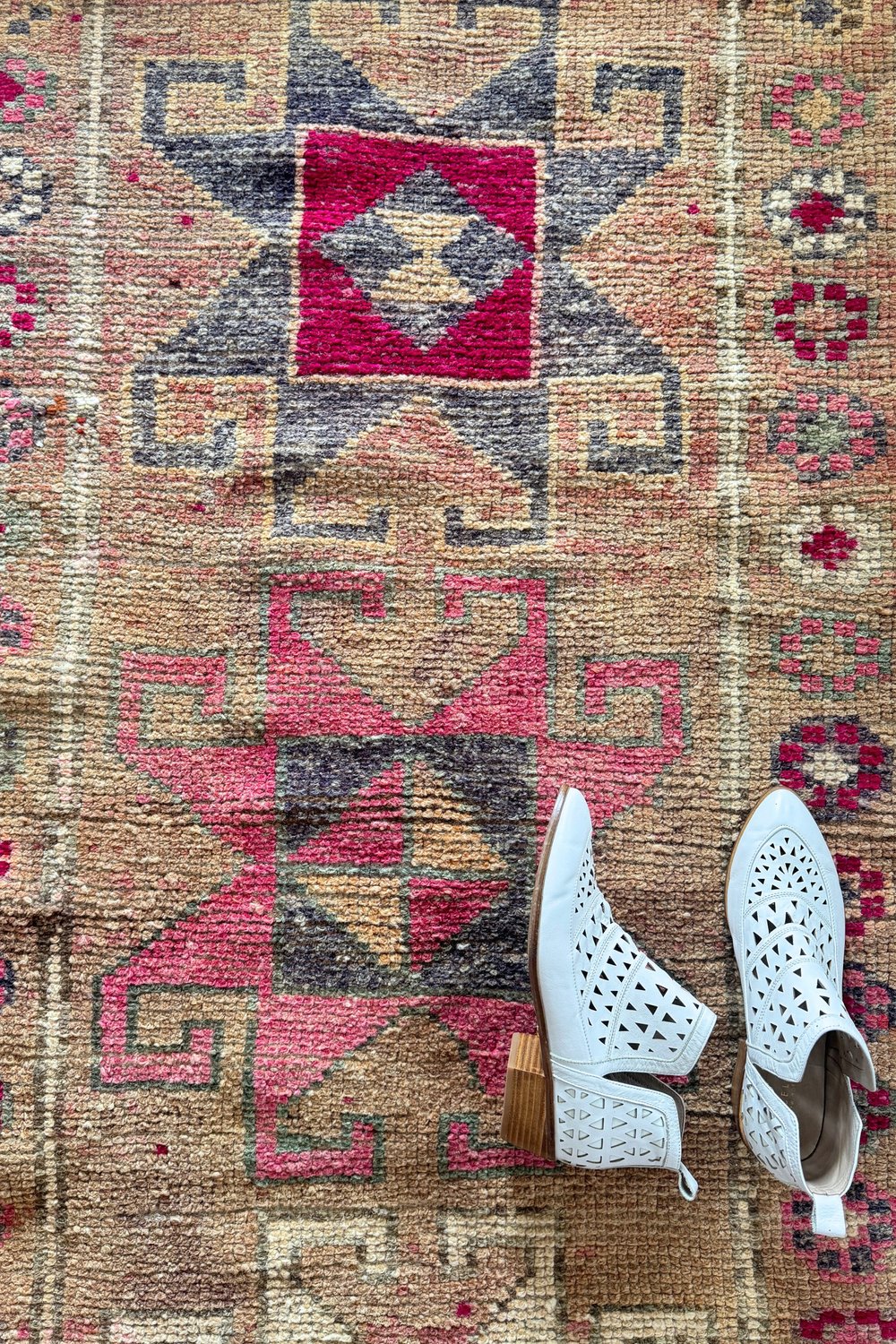 'Haven' Vintage Turkish Runner - 2'9" x 13'0.5" - Canary Lane
Close up of a vintage handwoven Turkish runner with intricate patterns and rich textures. Features geometric designs in taupe, pink, gray, fuchsia, and cream. A timeless piece that adds character and heritage to any space.