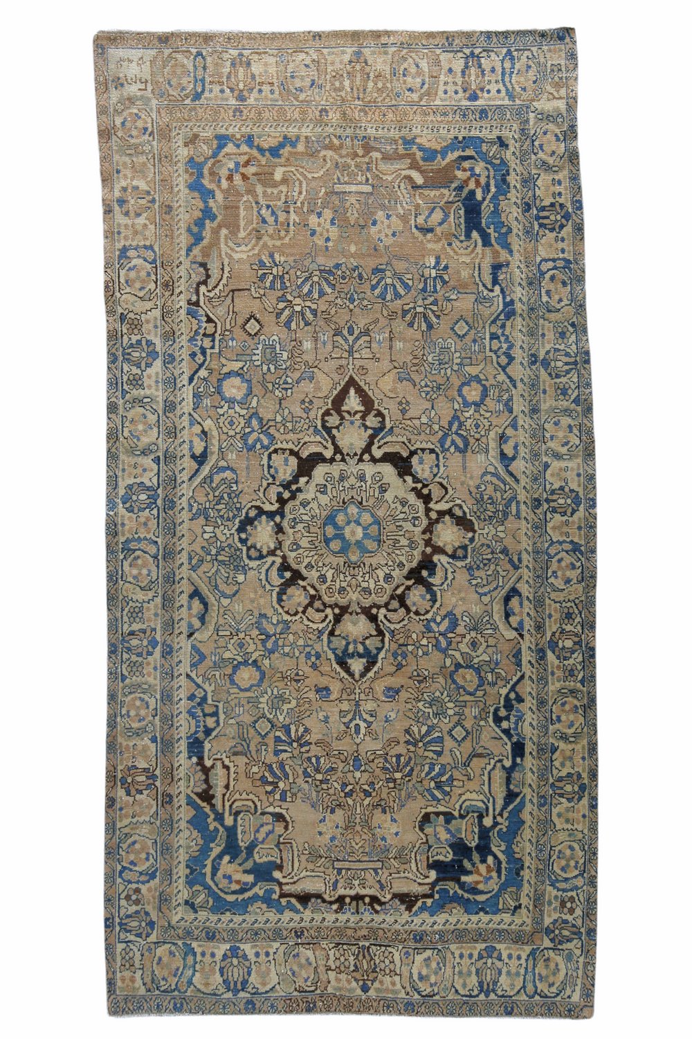 'Hayes' Vintage Persian Rug - 4'9" x 9'4" - Canary Lane
Vintage handwoven Persian area rug showcasing an intricate medallion pattern. The design features rich hues of blue, with a blend of warm tones and detailed borders. Its luxurious texture and classic style bring sophistication and warmth to any space.