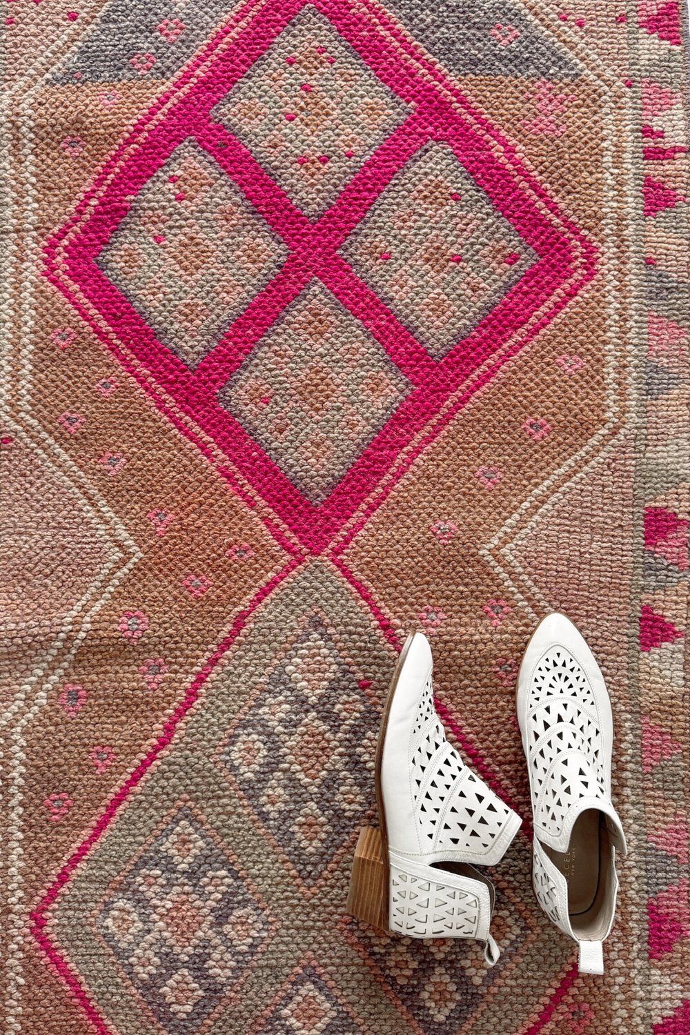 'Moon' Vintage Turkish Runner - 2'6.5" x 13'1.5" - Canary Lane
Close up of a vintage handwoven Turkish runner with an intricate diamond pattern and rich textures. Features geometric designs in peach, blush, pink, purple, gray, and cream. A timeless piece that adds character and heritage to any space.